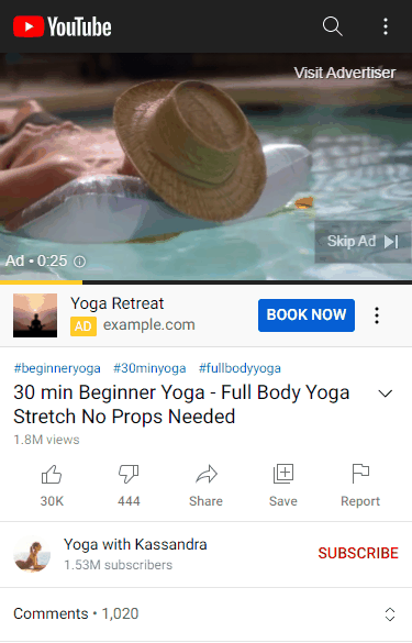 A YouTube video page on a phone with an in-stream ad playing, showing the Skip Ad button on the player and the advertiser banner underneath it